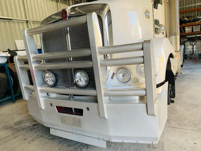 Before: the same Kenworth bull bar, dull and oxidised