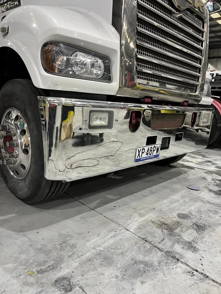 Mack prime mover with a mirror-polished front bumper and chrome grille